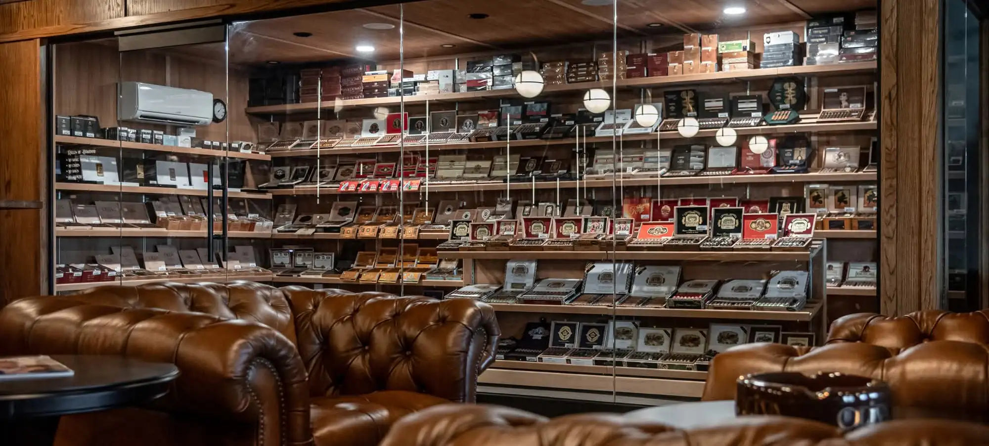 Walk-in humidor at Copper Leaf Cigar Lounge displaying premium cigars in Grand Island, NE. 