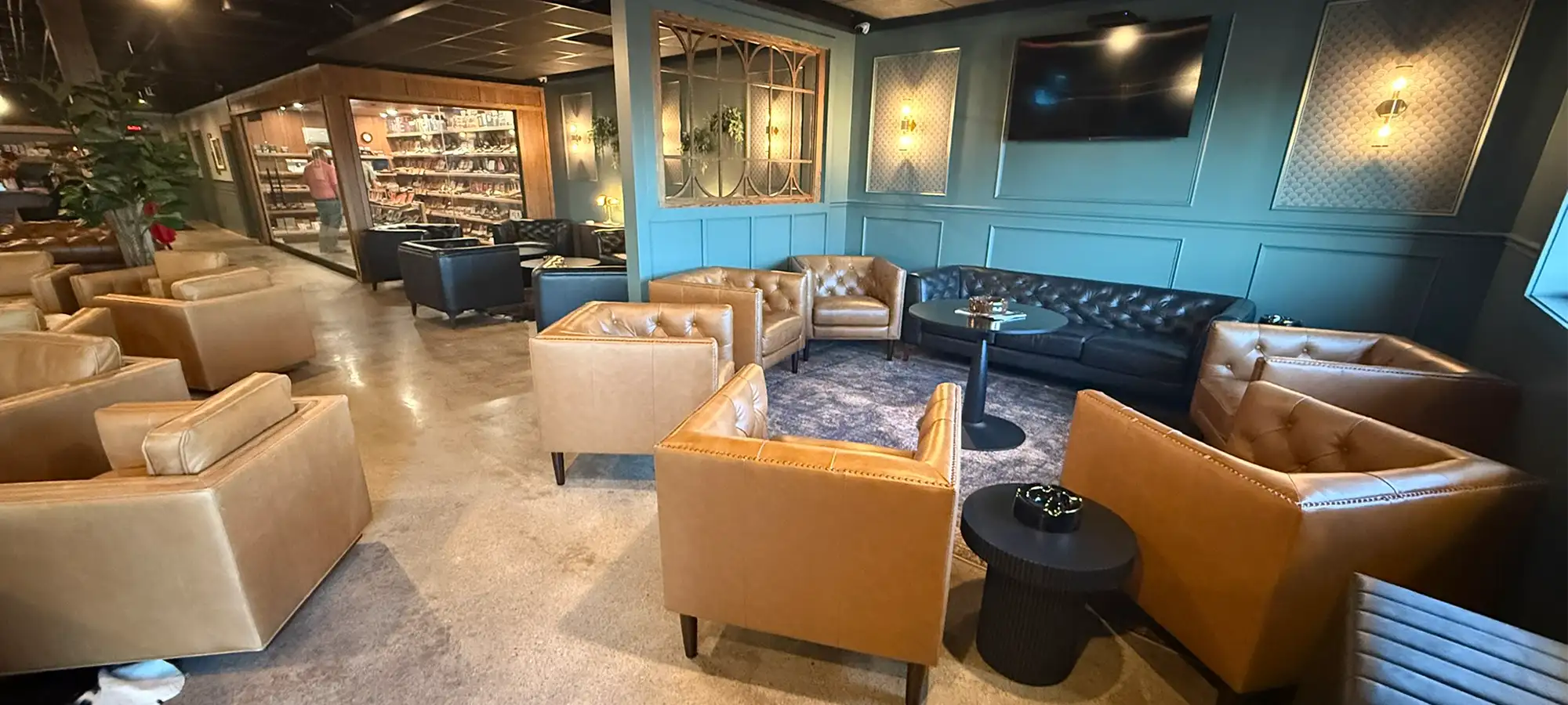 Interior of Copper Leaf Cigar Lounge featuring comfortable seating and warm lighting in Grand Island, NE.